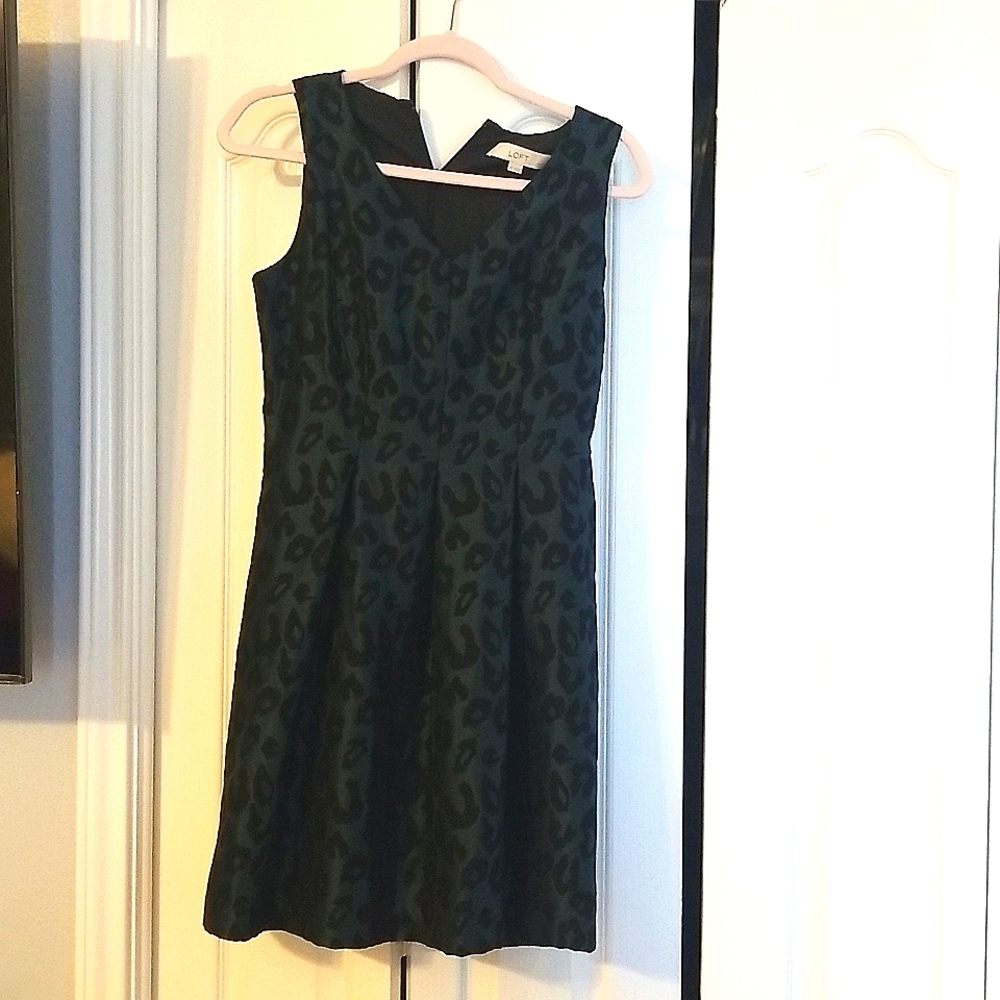 Dark green with black designs, v neck, sinched/pleaded waist, size 4P